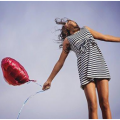 Healthy girl holding a balloon