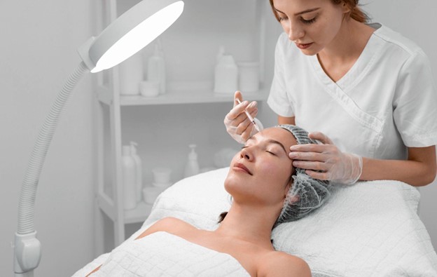 Beautician Doing Filler Injection For Female Client